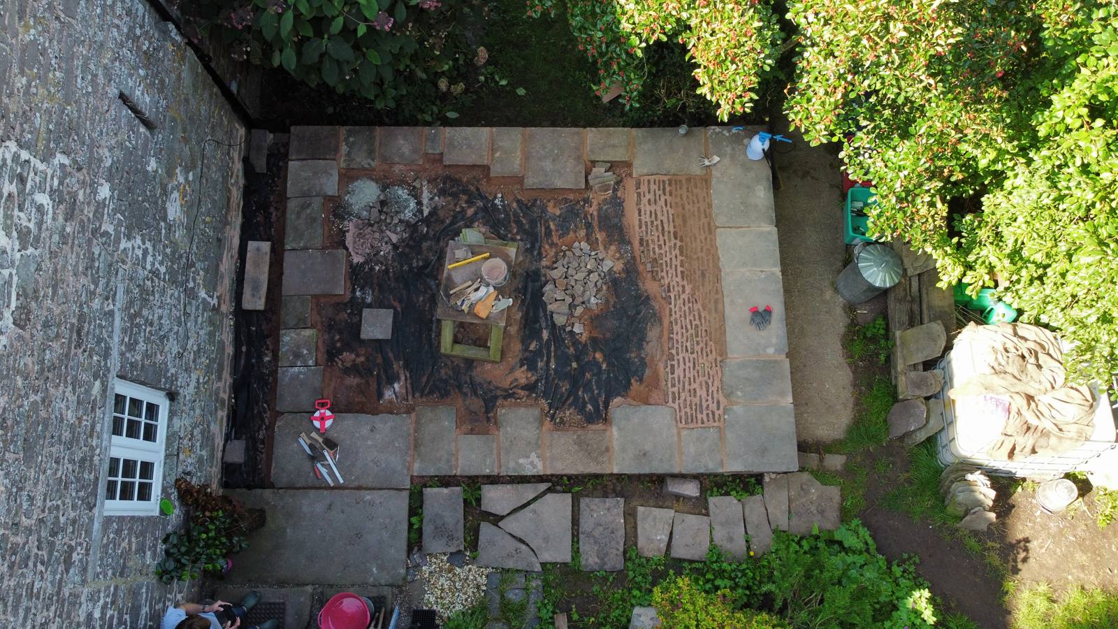 Aerial view of the cobbled courtyard being laid in the traditional method, September 2023